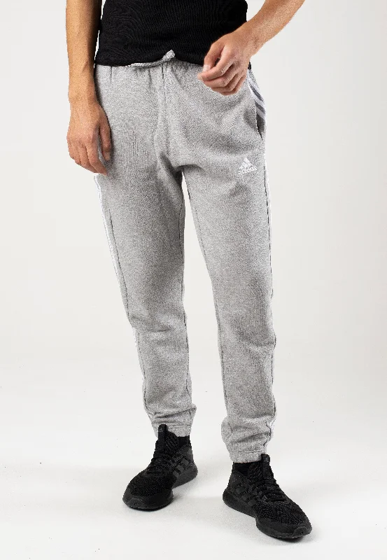 Blue sports pant for running -Adidas - Essentials French Terry Tapered Cuff 3-Stripes Mgreyh/White - Sweat Pants